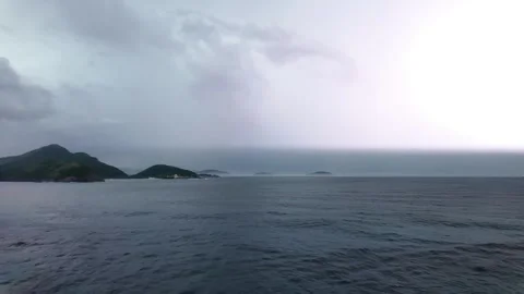 Lightning Illuminates the Ocean Under a Stormy Sky Stock Footage 296428086