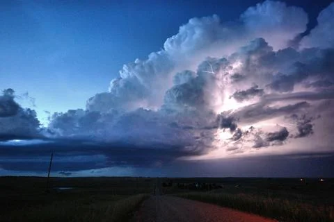 Lightning Illuminates a Small Supercell at Twilight in North Dakota - TIFF Stock Photos
