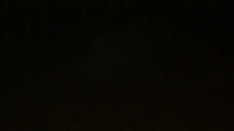 Lightning illuminating clouds in night sky Stock Footage 80965931