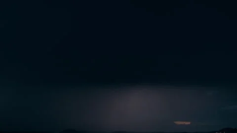 Lightning Illuminating Thick Grey Storm Clouds Stock Footage 340470812