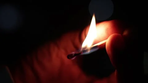Lightning up matchstick in dark room close-up Stock Footage 255547283