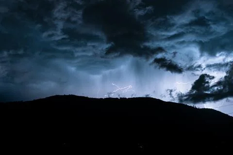 Lightning in the mountains at night Stock Photos