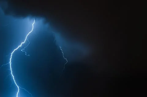 Lightning in the night sky. Thunderstorm over the city. Stormy clouds and r.. Fotos Stock