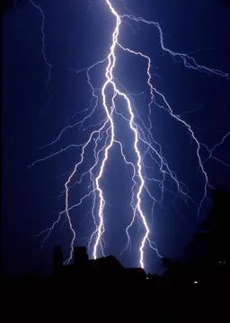 Lightning in the night sky thunderstorm Stock Photos