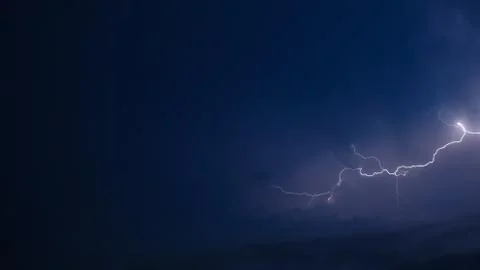 Lightning over blue Stock Photos