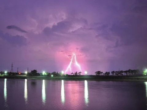 Lightning over lake Stock Photos