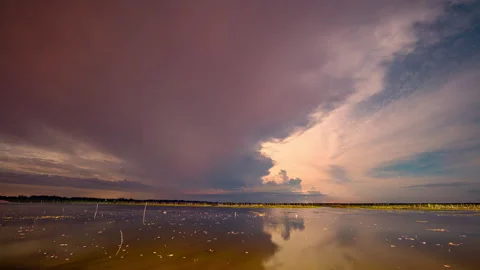 Lightning over the lake Reflections Beneath the Storm Stock Footage 314841891