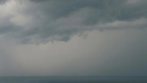 Lightning over the sea with dark clouds. Sea storm Stock Footage 94557315