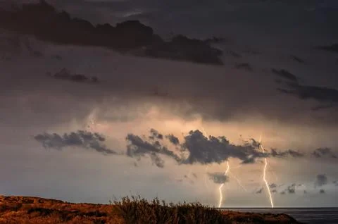 Lightning over sea Stock Photos