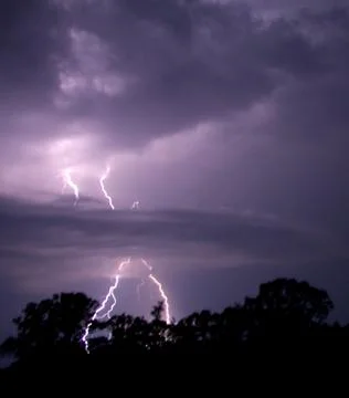 Lightning penetrates clouds Stock Photos