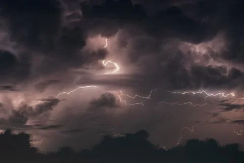Lightning in the rainstorm at night Stock Photos