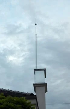 Lightning rod and clouds Stock Photos