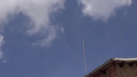 Lightning rod clouds sky building roof storm Stock Footage 318225703