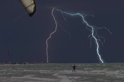 Lightning at sea beach on A thunderstorm cloud Stock Photos