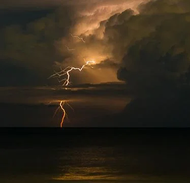 Lightning at sea Stock Photos