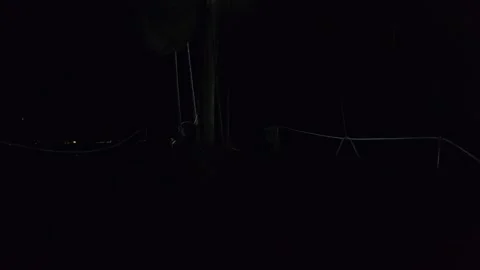 Lightning seen across the sky from sailboat Stock Footage 195480687