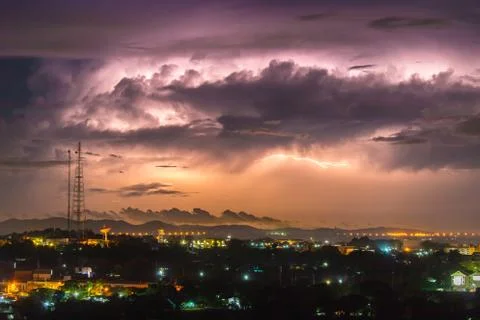 Lightning on the sky is covered with gray clouds in the rainy season Stock Photos