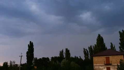 Lightning, slow motion. A cloudy sky with a house Stock Footage 274064981