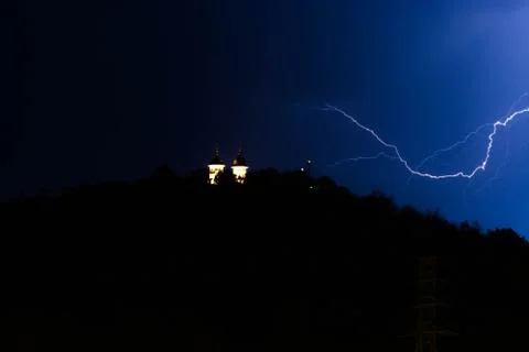 LIghtning stike over the chapel during the storm Stock Photos