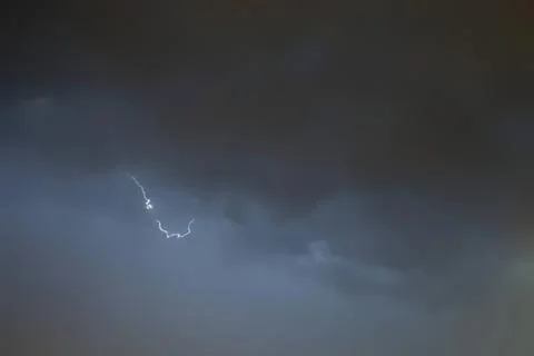 Lightning storm in dark cloudy sky during a thunderstorm Stock Photos
