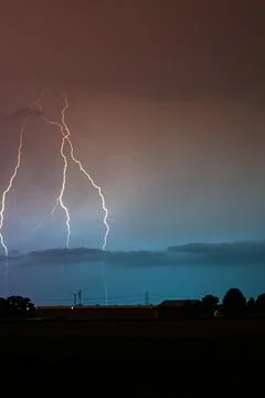 Lightning storm at night Stock Photos