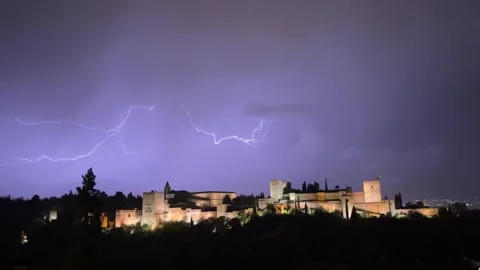 Lightning storm over the illuminated Alhambra at night, Granada Stock Footage 344411998