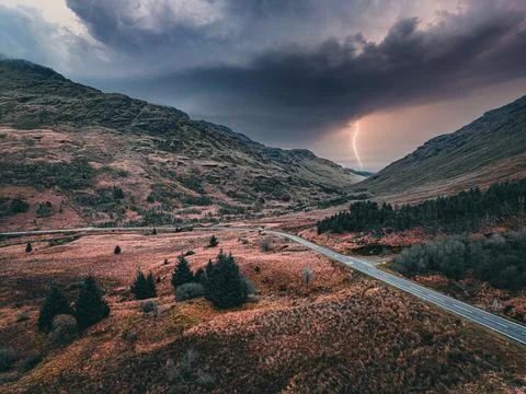 Lightning Storm Over Mountain Valley Road — Dramatic Thunderstorm Stock Photos
