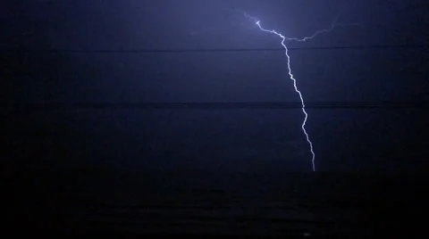 Lightning storm over ocean slow motion 720p Stock Footage