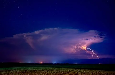 Lightning storm over open field Stock Photos