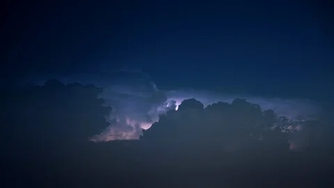 Lightning storm as stars fall into billowing night clouds 8K Video stock 108488019