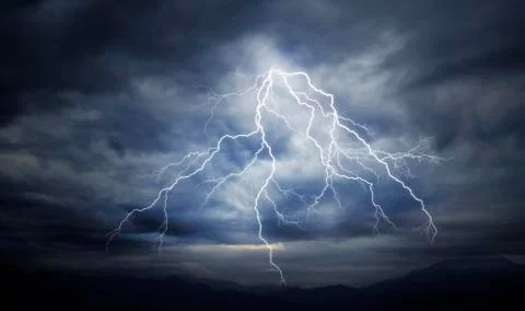 Lightning strike on the cloudy sky Stock Photos
