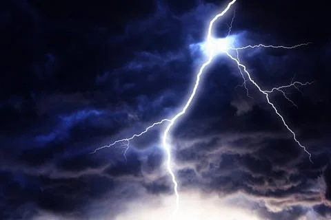 Lightning strike on a dark sky. Stock Photos