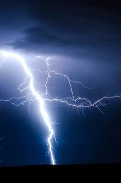 Lightning Strike During Blue Sky Stock Photos
