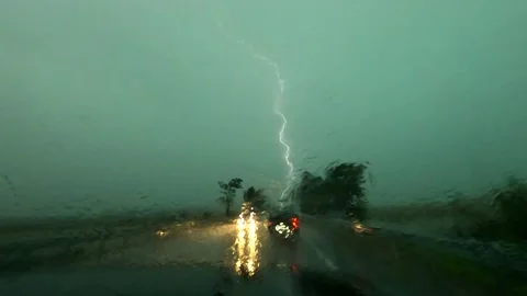Lightning strike during heavy rain in the center of a hurricane Stock Footage 158143250