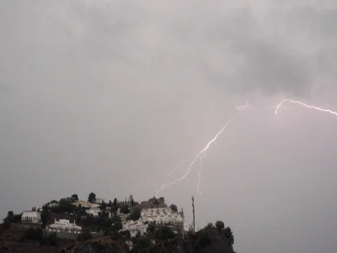 Lightning strike over the hill at thunderstorm. 4x slow Stock Footage 81311597