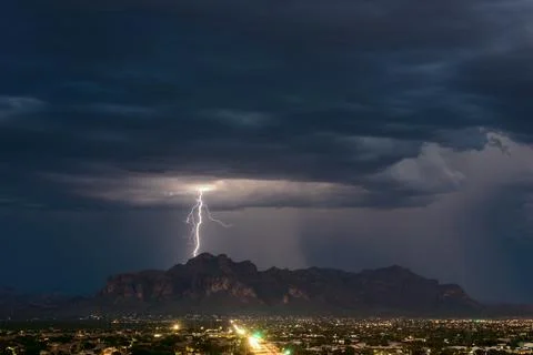 Lightning strike over the Superstition Mountains in Arizona Stock Photos