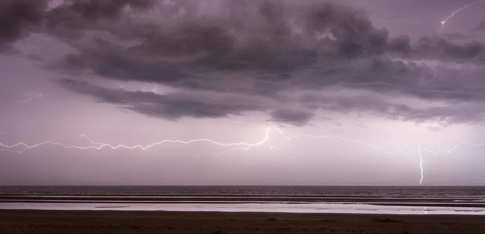 Lightning strike on the sea Stock Photos
