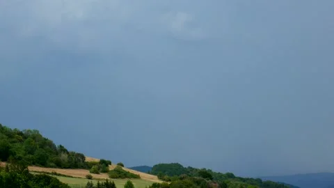 Lightning strike with the sound of thunder over the hilly landscape Stock Footage