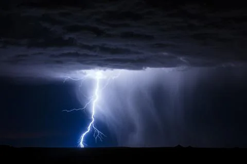 Lightning strike in a thunderstorm Stock Photos