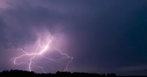 Lightning strikes and storm clouds extreme thunderstorm at night timelapse Stock Footage 134742474