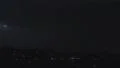 Lightning strikes buildings in city sky. Thunder roars with sound HD Footage