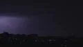 Lightning strikes buildings in city sky. Thunder roars with sound 4k or 4k+ Resolution