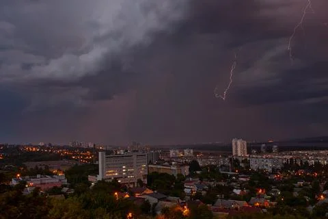 Lightning strikes at the city at night Stock Photos