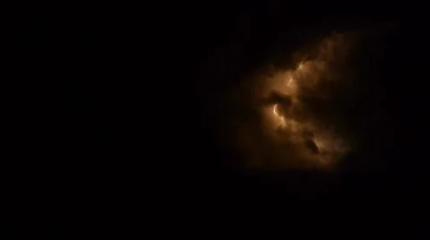 Lightning strikes during a thunderstorm in the night sky with storm clouds Stock Footage 55884337