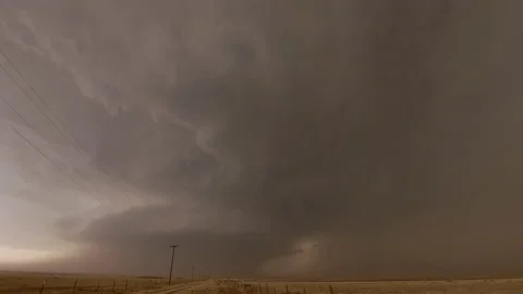 Lightning strikes the ground in front of tornado supercell in Texas Stock Footage 196241337