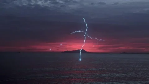 Lightning Strikes at Ocean Sunset Video stock 325328891