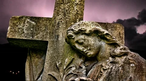 Lightning strikes over graveyard statue Stock Footage 10608572