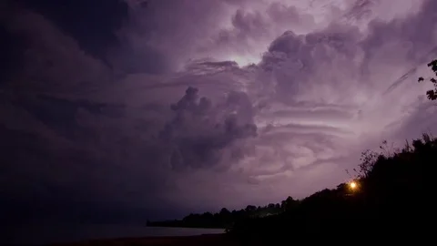 Lightning Strikes Over Mountains and sea Stock-Footage 83758275