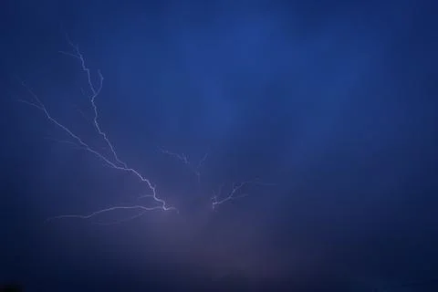 Lightning in a summer thunderstorm Stock Photos