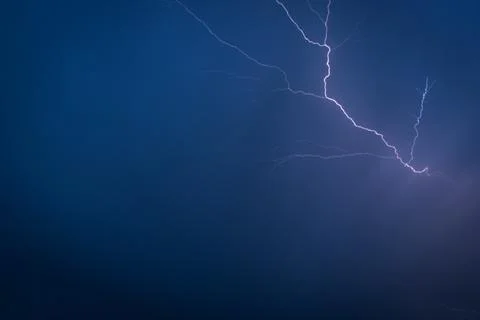 Lightning in a summer thunderstorm Stock Photos